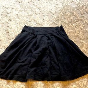 Pleated black mini skirt